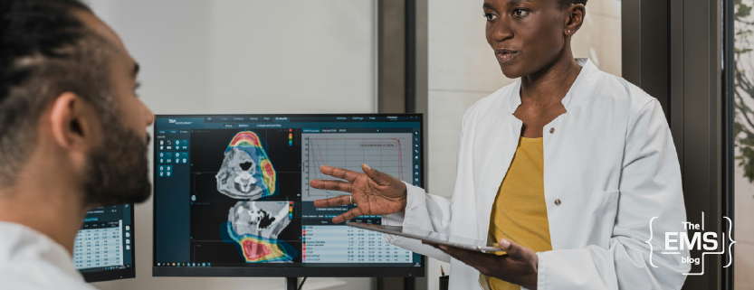 doctor-discussing-diagnostic-images-with-colleague-using-digital-medical-display