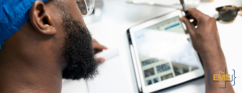 medical-professional-using-tablet-for-clinical-data-review-in-healthcare-setting